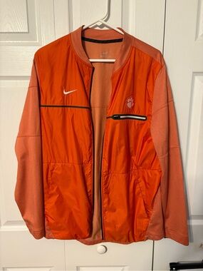 Nike Men’s Orange Lightweight Jacket with Paw Emblem